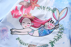 Close-up of girls' long sleeve swimwear with colorful mermaid and ocean theme print