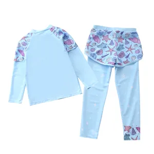 Detail of girls long sleeve sun protection swimwear with ocean starfish pattern