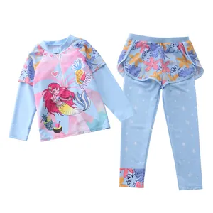 Detail of girls two-piece long sleeve swimsuit with floral prints and mermaid graphics