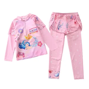 Detail of pink long sleeve kids' swimsuit with mermaid print and ruffled skirt waist
