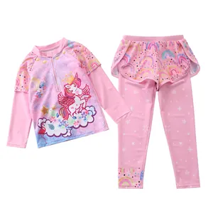 Detailed view of pink girls long-sleeved swimsuit set with unicorn and rainbow prints