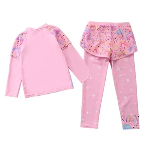 Detail view of girls' long sleeve swimwear with rainbow prints and sun protection fabric