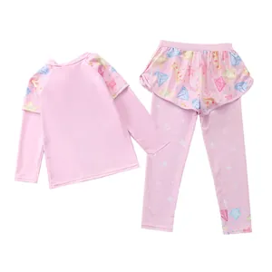 Girls' pink long-sleeve rash guard set with diamond patterns and ruffled skirted leggings