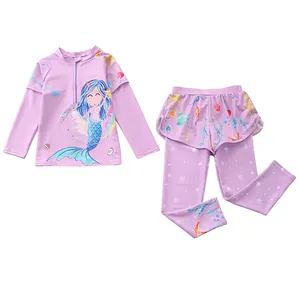 Detail of girls' long sleeve swimsuit set with purple mermaid print and ruffled long pants