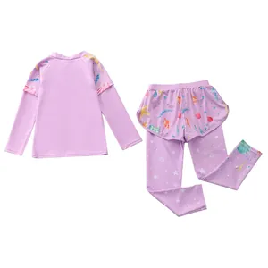 Detail of girls two-piece long sleeve swimsuit with floral mesh skirt and sea patterns