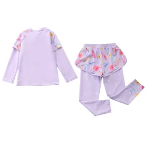 Detail of girls two-piece long sleeve sun protection swimsuit with floral print
