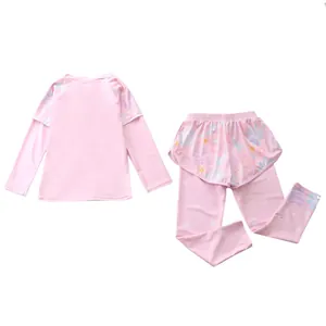 Detail of pink floral long-sleeve kids swimsuit with elastic quick-dry fabric texture