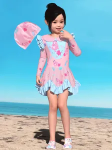 Girl's long-sleeve ruffled swimsuit set with mermaid prints and matching beach shoes