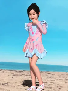 Pink mermaid kids one-piece swimsuit with long sleeves, ruffles and matching water shoes