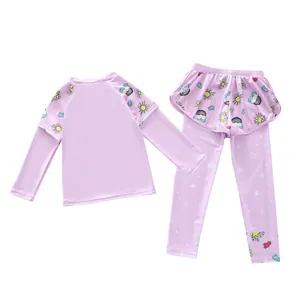 Detailed view of girls' long-sleeved purple swimsuit with rainbow cartoon prints