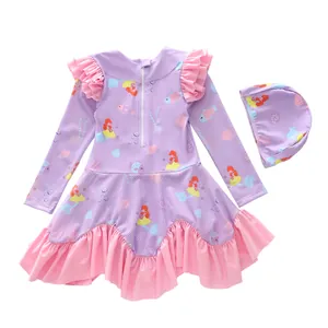 Detailed flat lay of girls' lavender long-sleeve swimsuit and cap with mermaid prints