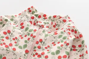 Detail of strawberry print long sleeve kids swimsuit with smooth zipper and collar