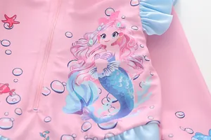 Detail of girls' long sleeve swimsuit with pink mermaid print and blue ruffle trim
