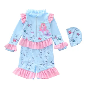 Detail of girls long sleeve swimsuit with ruffles and ocean mermaid pattern