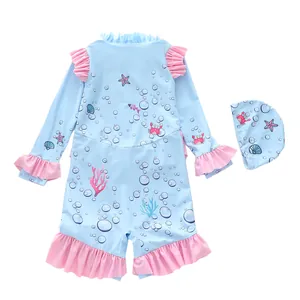 Detail of baby long sleeve swimsuit with pink ruffles and ocean cartoon print