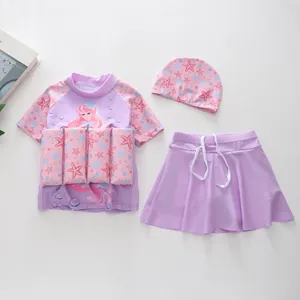 Detailed flat lay of three-piece mermaid buoyancy swimsuit with pink and purple tones