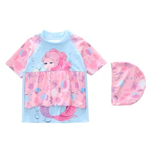 Detail of girls' mermaid buoyancy swimsuit with ruffles and matching swim cap