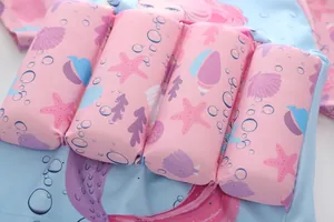 Detail of mermaid kids' flotation swimsuit featuring four pink foam buoyancy blocks