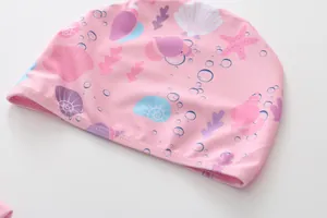 Pink swim cap for girls with high-quality shell and coral ocean patterns in detail