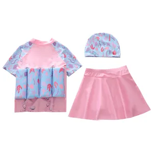 Three-piece girls' buoyancy swimsuit set with pink short-sleeved top and swim skirt