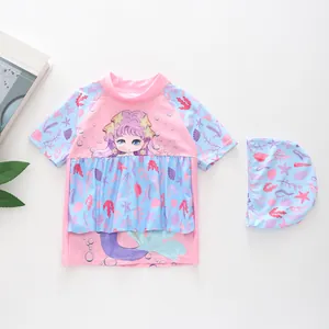 Detail of two-piece girls' swimsuit with mermaid print and ruffled starfish patterns