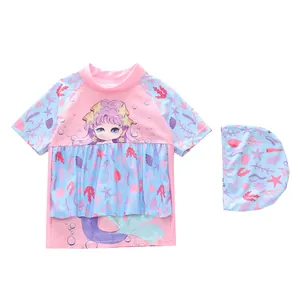 Detail of girls two-piece swimsuit with cartoon mermaid print and ruffle waist