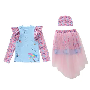 Detailed flat lay of a girls' three-piece swimsuit with ocean patterns and star prints