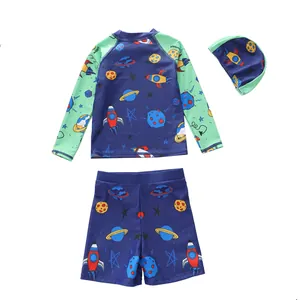 Three-piece boys' swimwear set with long sleeves, cartoon space prints, and swim cap