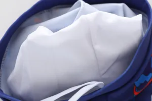 Detail of boys' swimwear showing breathable white mesh lining and white drawstring