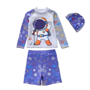 Three-piece boys long sleeve swimwear set featuring astronaut and rocket space prints