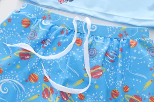 Detail of light blue boys swimwear featuring space planet prints and elastic waistband