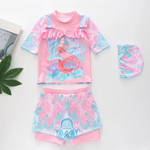 Three-piece girls' mermaid swimsuit set with ruffled top, swim trunks and cap