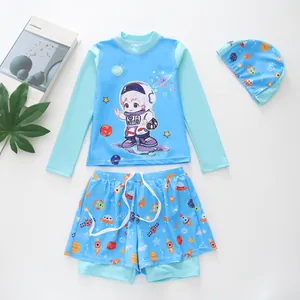 Three-piece kids swimwear set with astronaut pattern and matching swim cap in sky blue