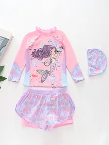 Flat lay view of a 3-piece pink mermaid swimsuit set with long sleeves and swim cap