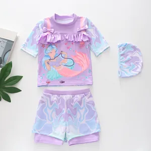 Close-up of girls mermaid swimsuit featuring ruffles, bow detail and lavender pattern