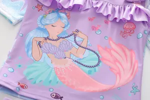 Detail of mermaid print on light purple girls swimsuit with ruffled neck and sea elements