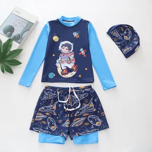 Detail view of boys' three-piece space-themed swimwear with astronaut print and matching cap