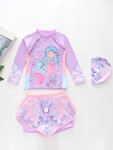 Detailed view of 3-piece mermaid kids swimwear with long sleeve top and ruffle neckline