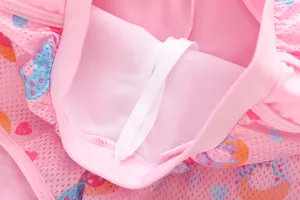 Detailed close-up of girls mermaid swimsuit with breathable mesh lining and drawstring