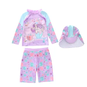 Three-piece girls mermaid swimwear set with long sleeve top, shorts and swim cap