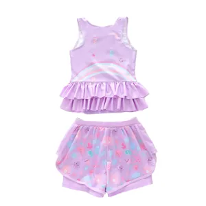 Close-up of girls' two-piece mermaid swimwear with ruffle hem and ocean prints