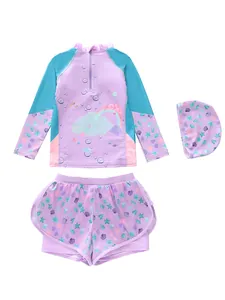 Flat lay of girls 3-piece lavender swimsuit with rainbow print and ocean motifs