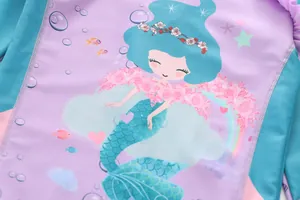 Detailed close-up of girls mermaid swimsuit with ruffled edges and princess print