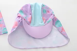 Detail of girls mermaid sun hat with neck protection and starfish shell print patterns