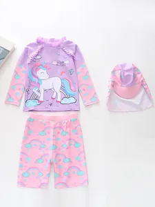 Detailed view of girls' long-sleeve sun protection swimsuit set with unicorn and rainbow print