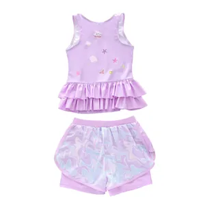 Detail of girls purple two-piece swimsuit with ruffle hem and ocean theme prints