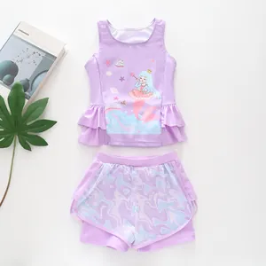 Detail of girls purple two-piece swimsuit with mermaid print and ruffled mesh waist