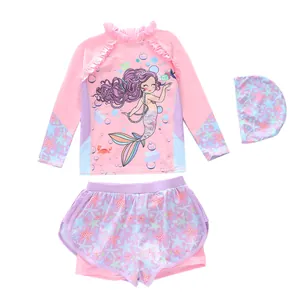 Three-piece girls mermaid swimsuit with long sleeve zip top, shorts and matching swim cap