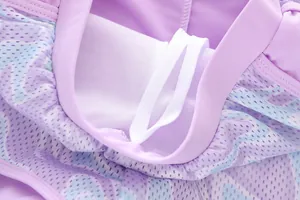 Detailed macro view of purple mesh fabric and white drawstring on mermaid girls swimwear