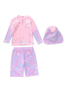 Detailed flat lay of three-piece kids sun protection swimwear with ocean theme patterns